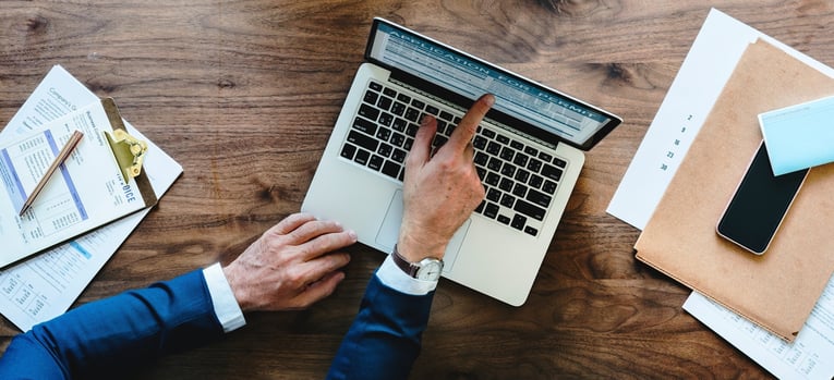 businessman pointing at computer