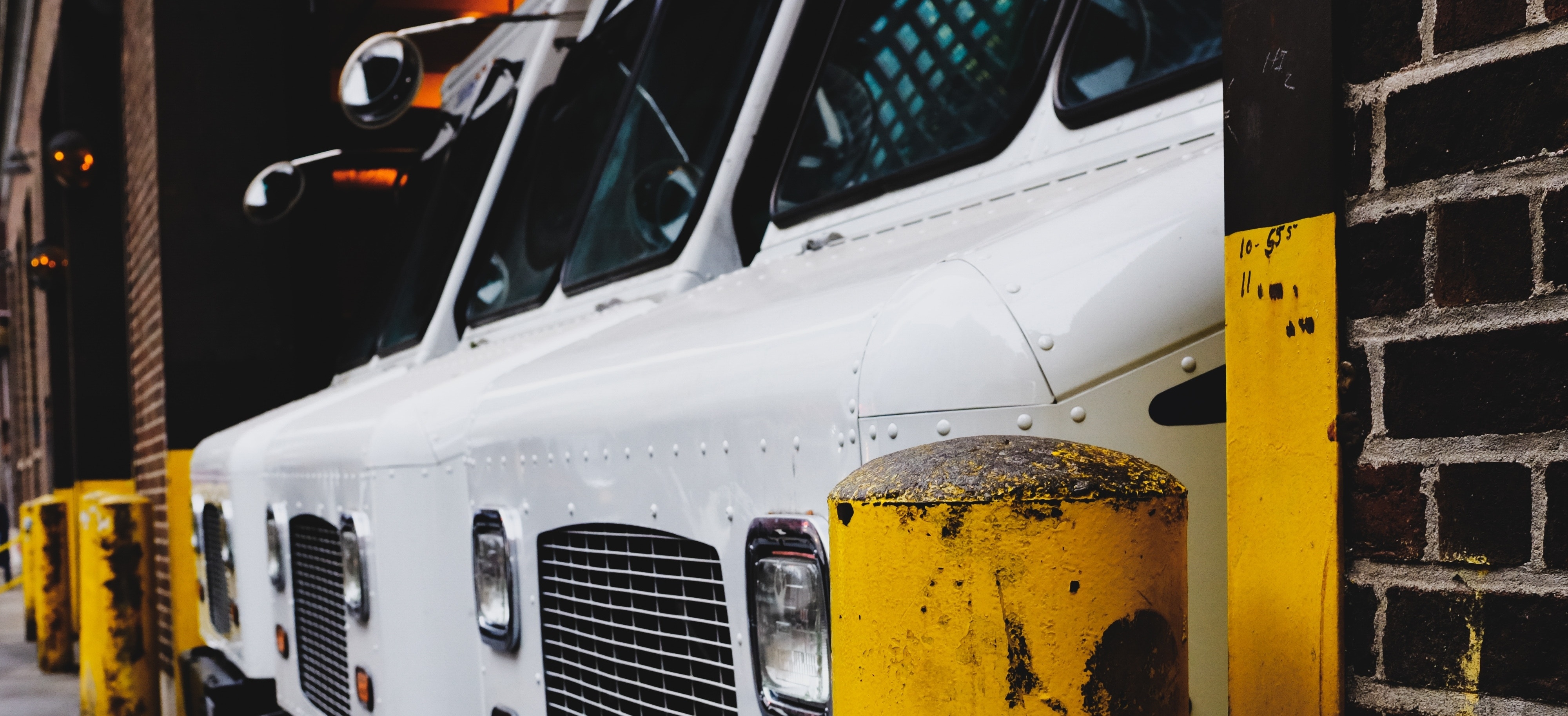 white vans parked in a garage